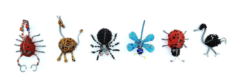 #9692 Butterfly, #9571 Dragon Fly, #9693 Lady Bug, #9694 Ostrich, #9695 Spider, #9696 Giraffe, #9697 Scorpion Refrig Magnets